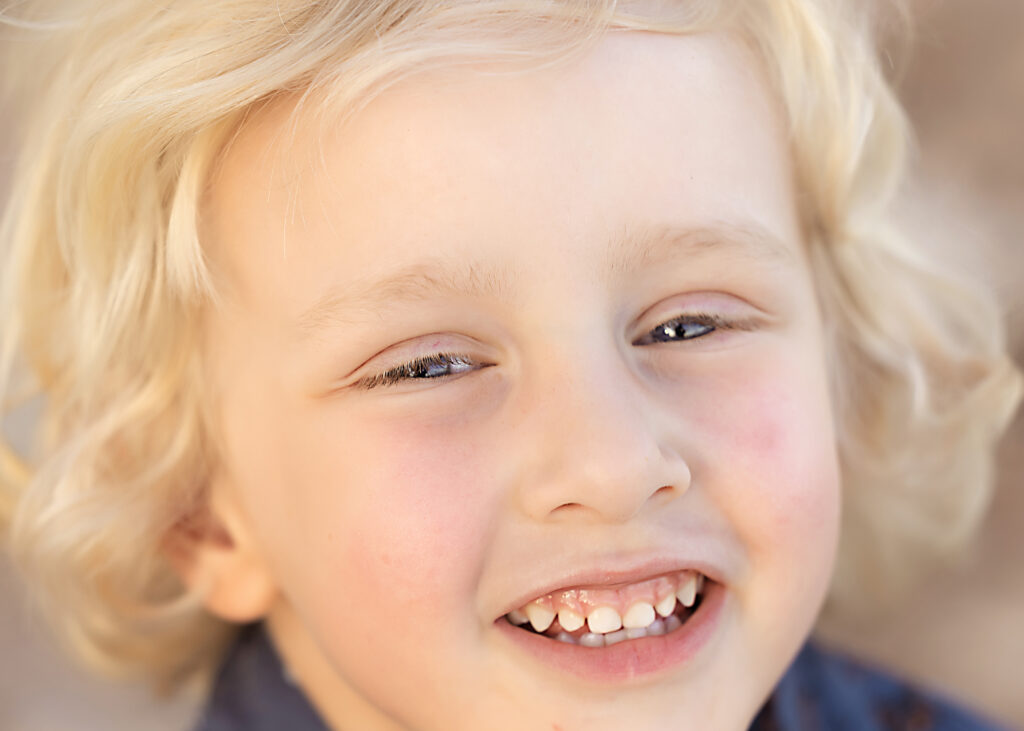 Child milestone photo session outdoors at Lake Whitney